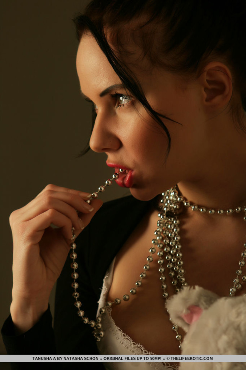 Tanusha A Lets Beads Flow Off Her Breasts